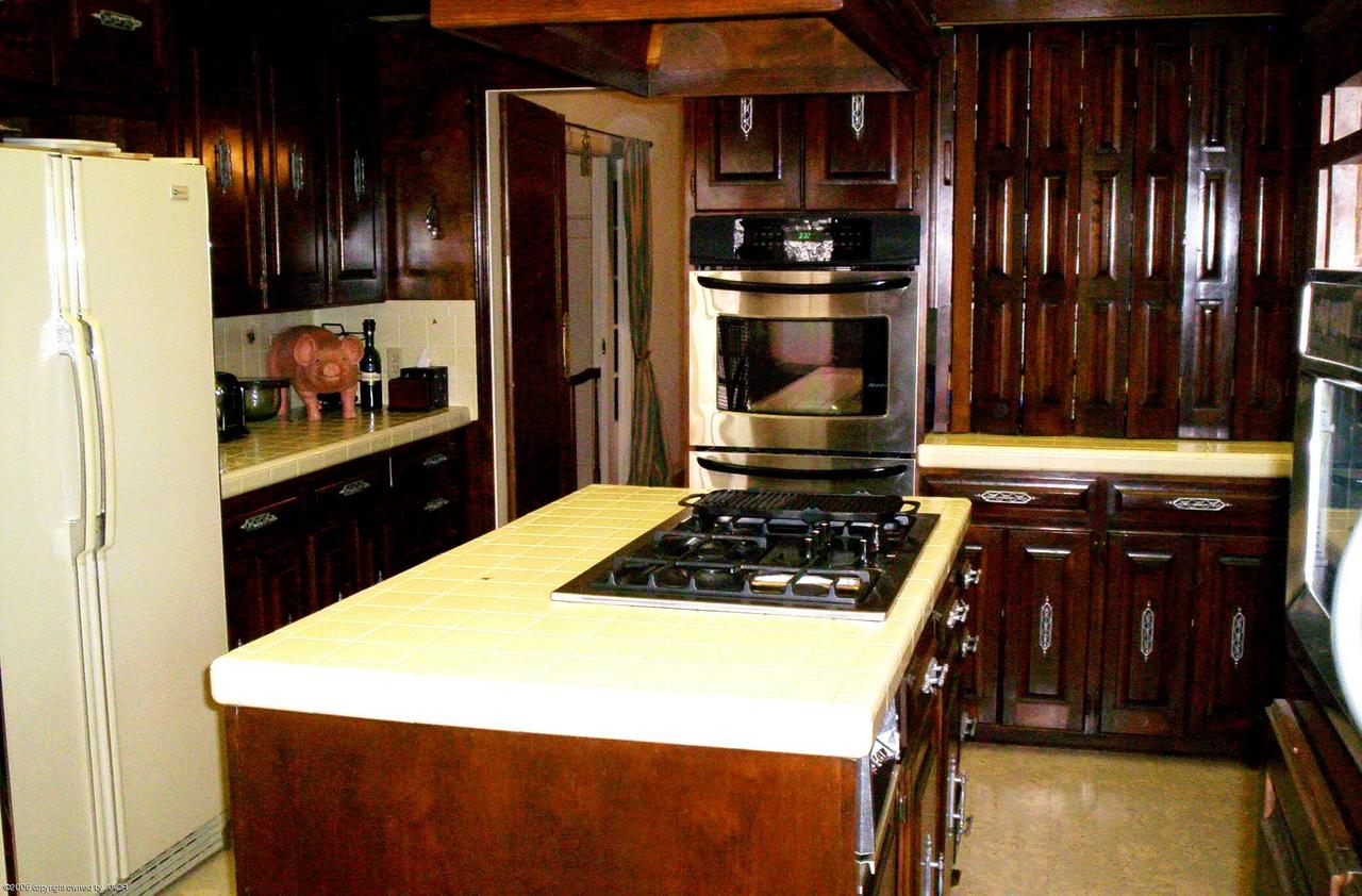 2011 3rd Avenue Canyon, TX 79015 - Photo 9 of 15 a kitchen with kitchen island a sink stove and refrigerator