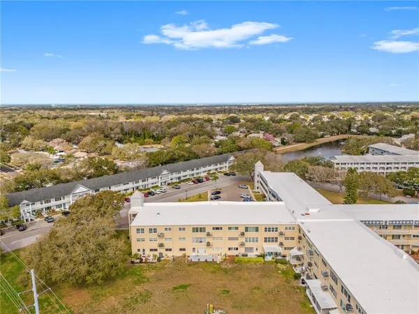 an aerial view of residential building and ocean