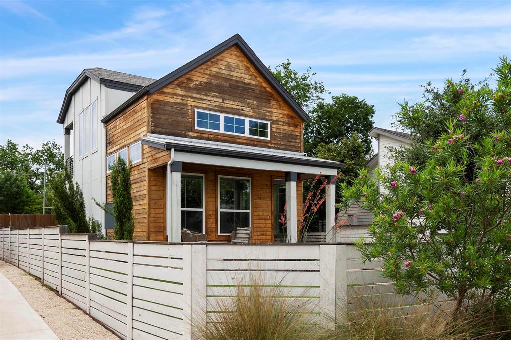 911 Stobaugh Street, Unit 2 Austin, TX 78757 - Photo 3 of 26 Contemporary architectural design featuring wood siding and a covered front porch