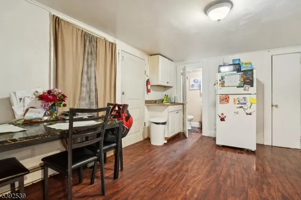 a kitchen with stainless steel appliances a stove a sink and a refrigerator