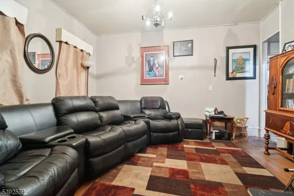 a living room with furniture a rug and a window