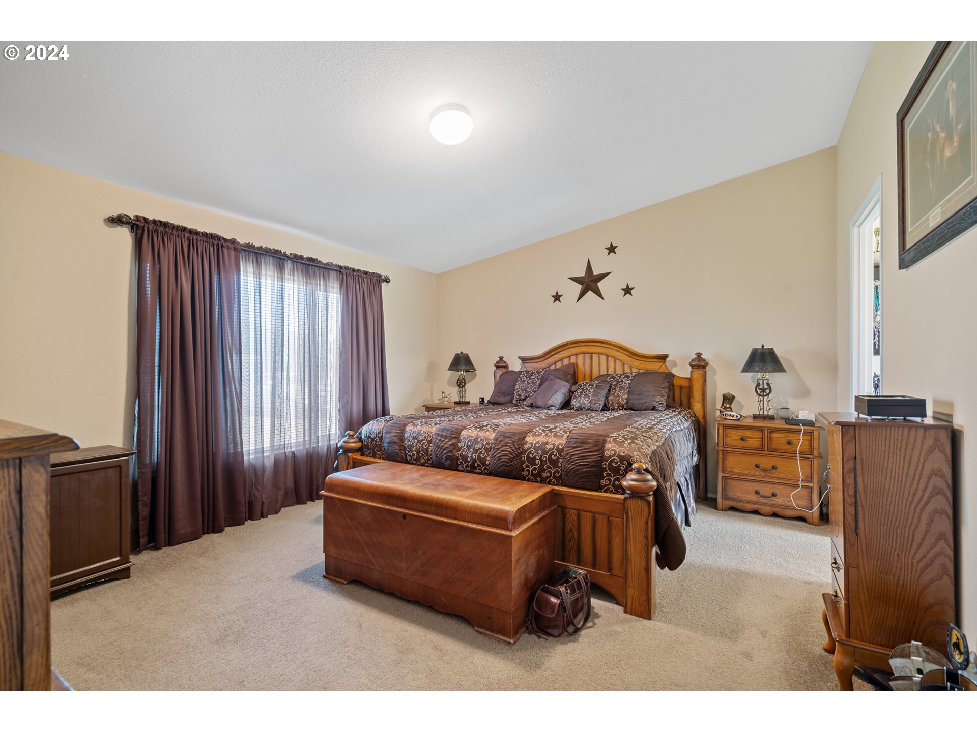 81385 North Golda Road Hermiston, OR 97838 - Photo 12 of 40 a bedroom with bed and window