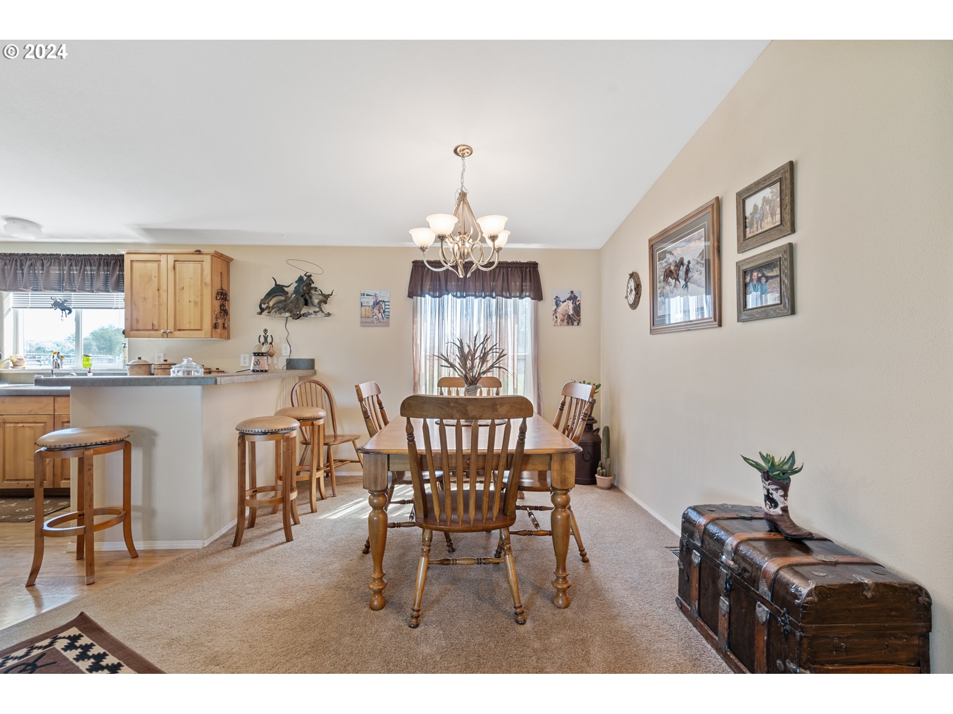 81385 North Golda Road Hermiston, OR 97838 - Photo 7 of 40 a view of a dining room with furniture and chandelier