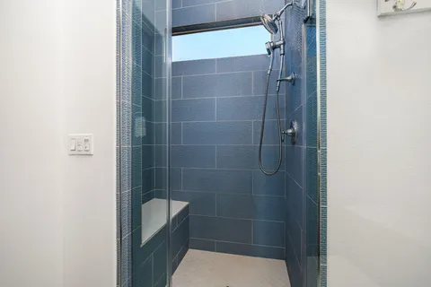 a bathroom with a tub and a window