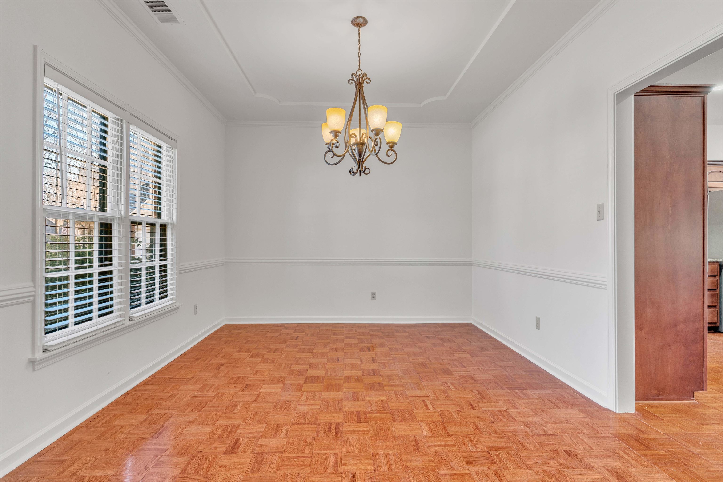 917 Valleyview Lane Collierville, TN 38017 - Photo 22 of 35 a view of empty room with wooden floor and fan