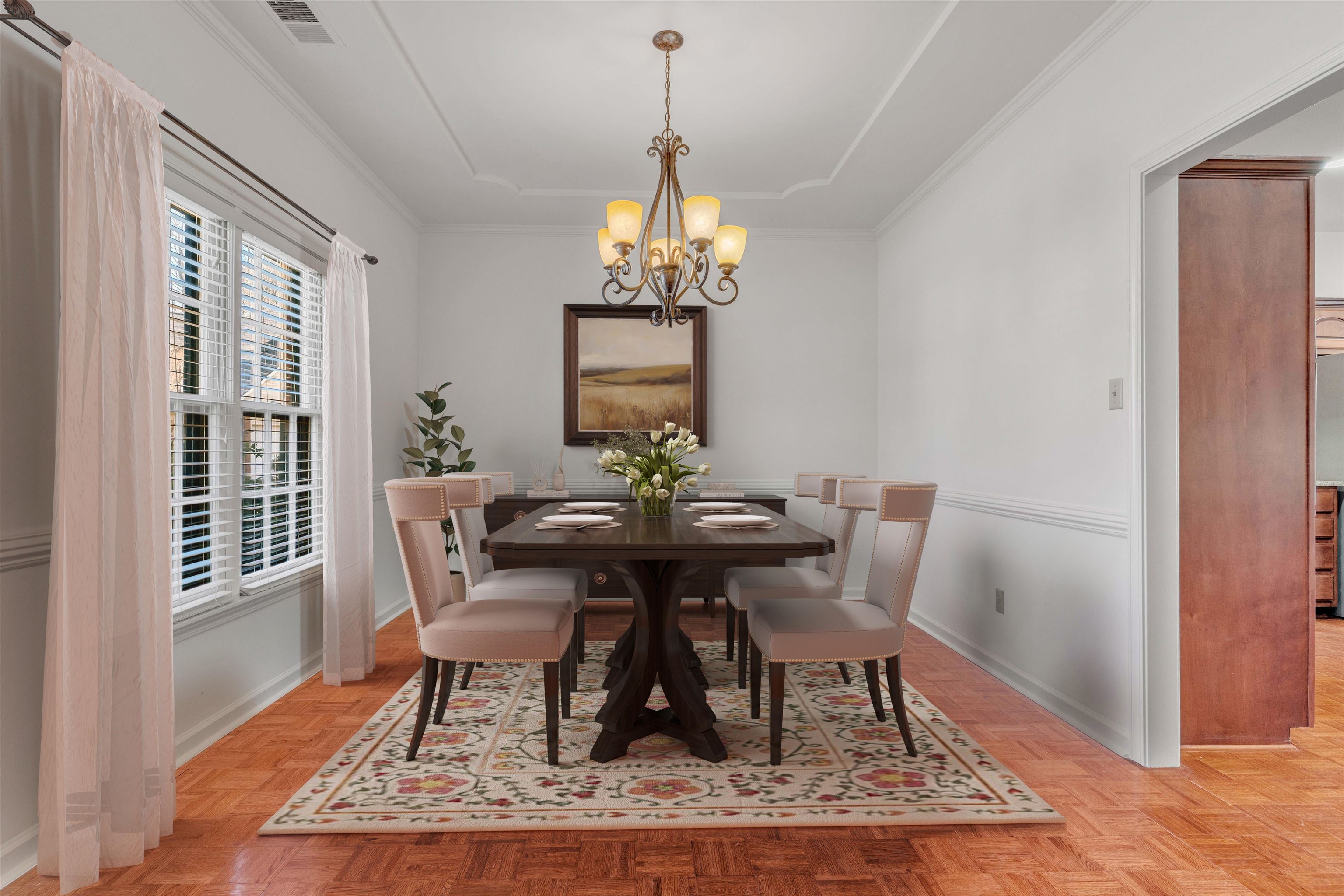 917 Valleyview Lane Collierville, TN 38017 - Photo 23 of 35 a dining room with wooden floor and a chandelier
