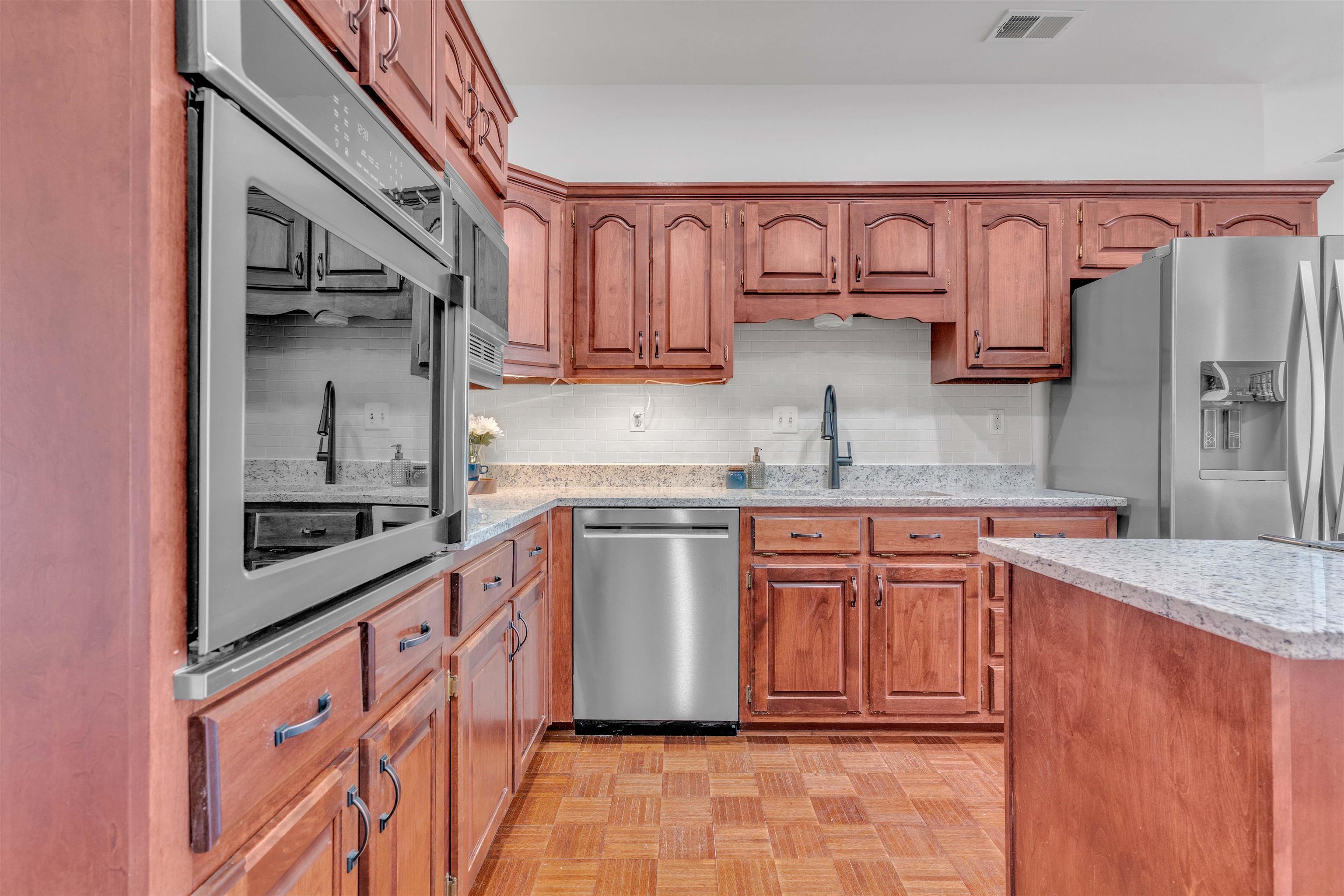 917 Valleyview Lane Collierville, TN 38017 - Photo 25 of 35 a kitchen with stainless steel appliances granite countertop a refrigerator and a sink