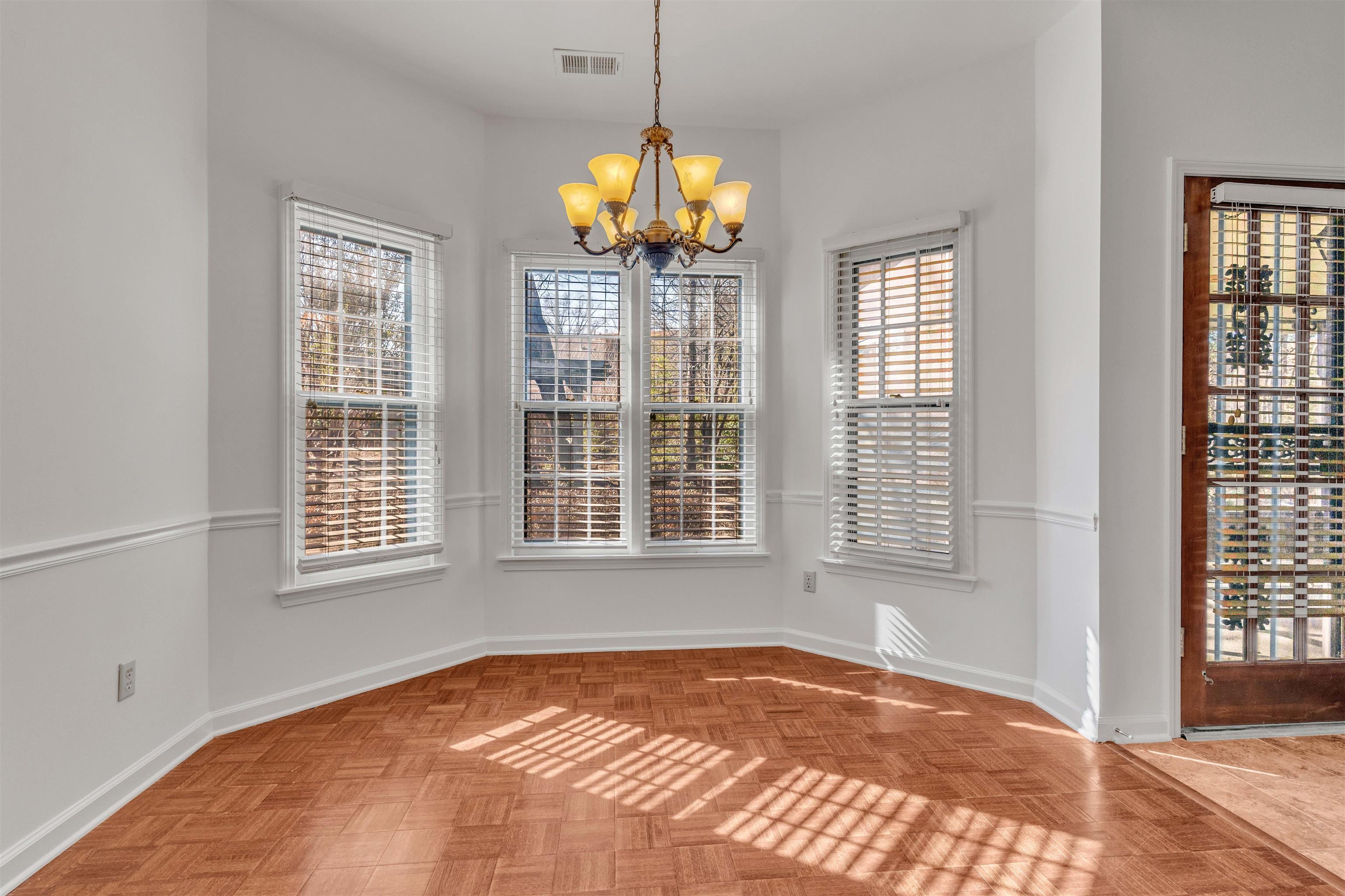 917 Valleyview Lane Collierville, TN 38017 - Photo 26 of 35 Unfurnished dining area with hanging lights and parquet floors