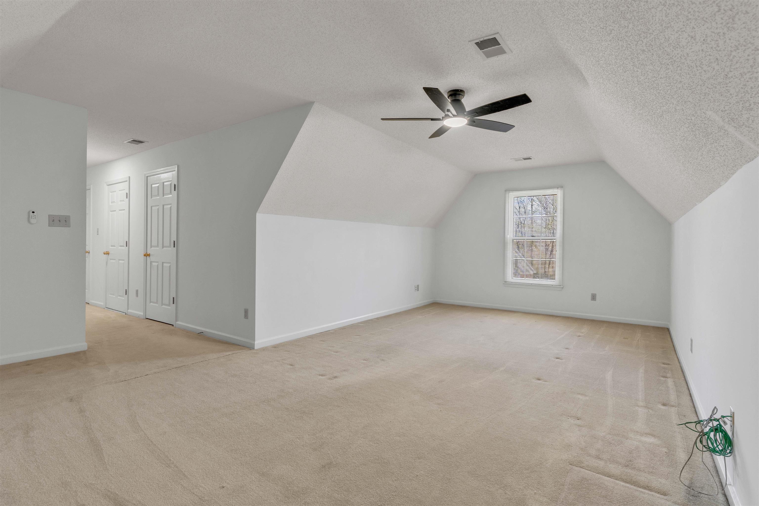 917 Valleyview Lane Collierville, TN 38017 - Photo 34 of 35 an empty room with a ceiling fan and a window