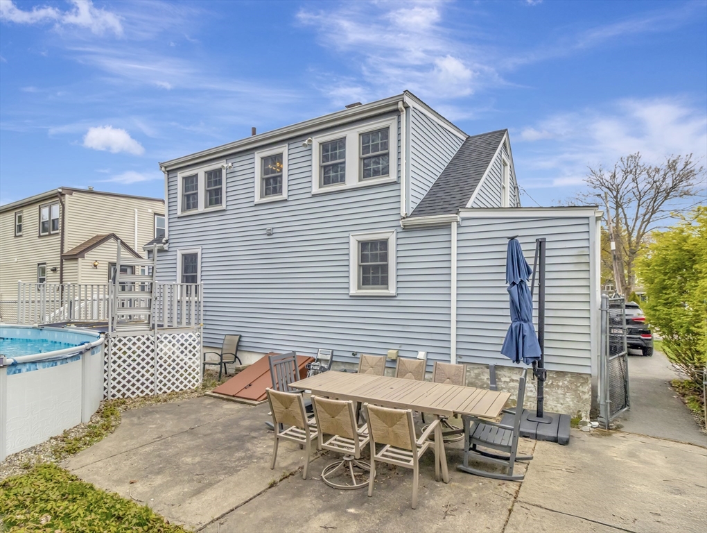 5 G Street Hull, MA 02045 - Photo 40 of 41 a view of a patio with a table and chairs and potted plants