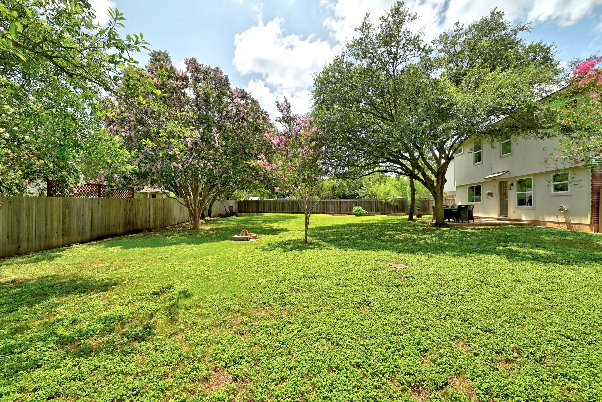 1801 Monks Tale Court Austin, TX 78748 - Photo 27 of 36 A spacious backyard with mature trees offers a private oasis for relaxation and entertaining.