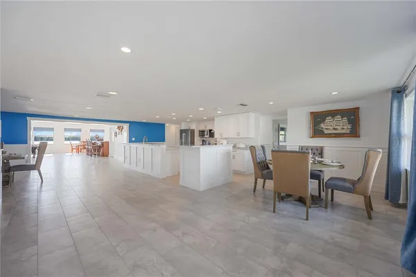 a view of a kitchen with cabinets and stainless steel appliances