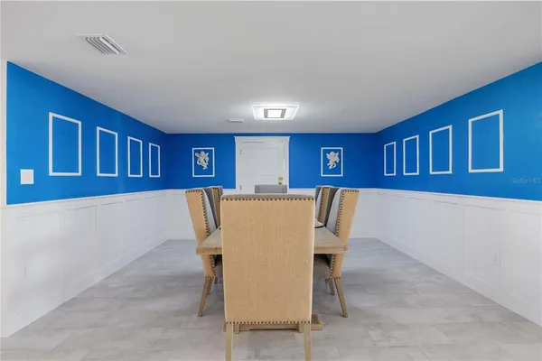 a dining room with furniture and window