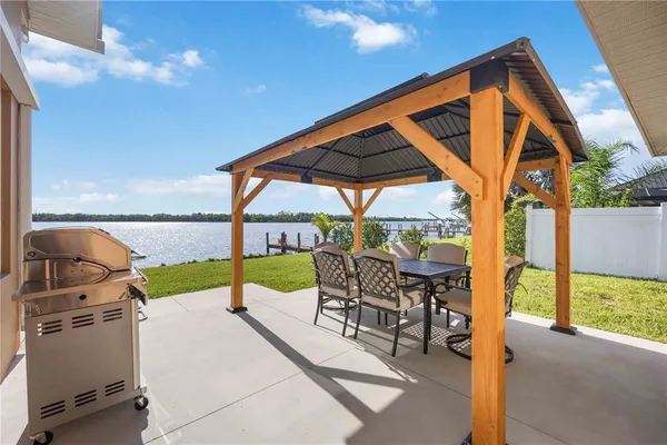 a view of a livingroom with furniture window and wooden floor