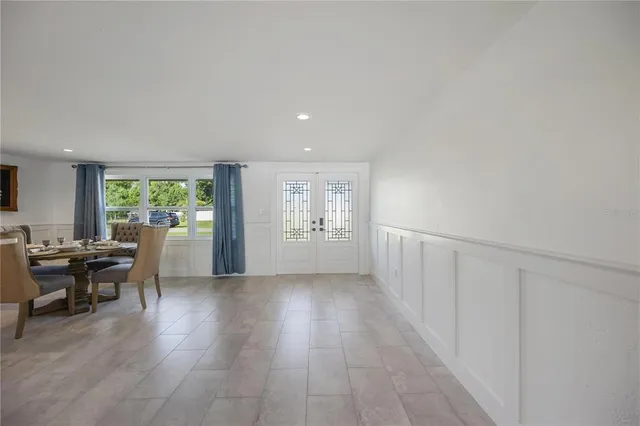 a view of a living room and kitchen view