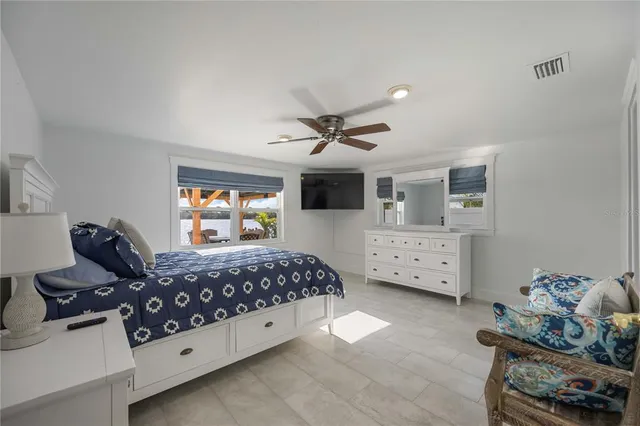 a bathroom with a sink shower and a mirror