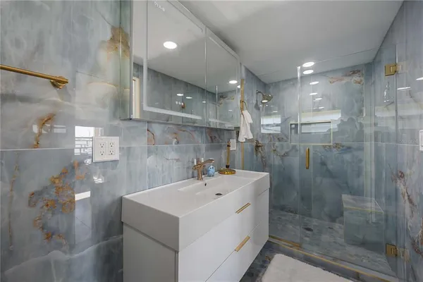 a utility room with sink dryer and washer