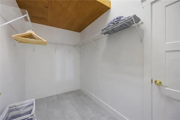 a kitchen with a refrigerator and table