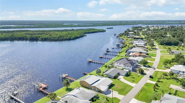 a aerial view of a house with a lake view
