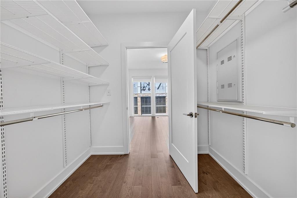 775 Juniper Street Northeast, Unit 413 Atlanta, GA 30308 - Photo 16 of 47 a view of a hallway with wooden floor and staircase