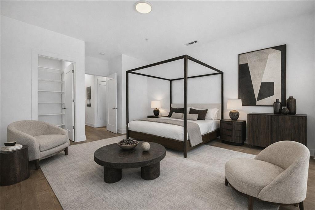 775 Juniper Street Northeast, Unit 413 Atlanta, GA 30308 - Photo 3 of 47 a living room with furniture and a potted plant