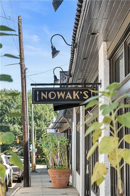 775 Juniper Street Northeast, Unit 413 Atlanta, GA 30308 - Photo 36 of 47 a front view of a building with garden