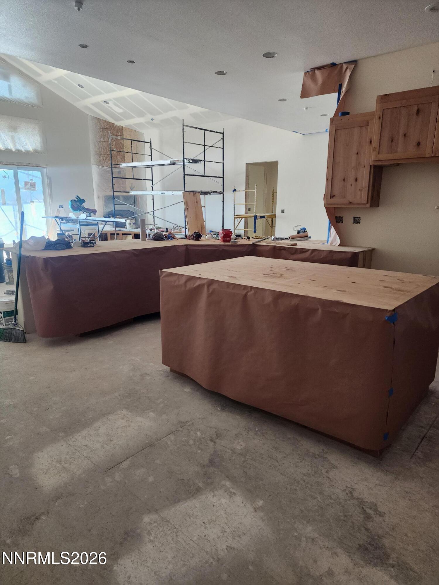2037 East Valley Road Minden, NV 89423 - Photo 14 of 32 a living room with stainless steel appliances kitchen island granite countertop a sink and cabinets
