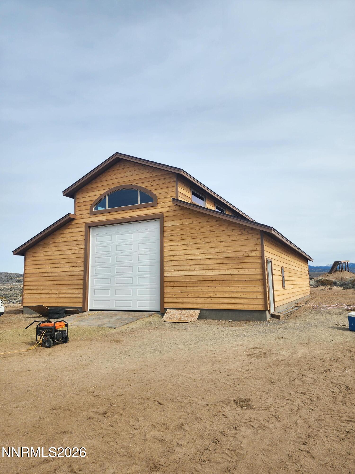 2037 East Valley Road Minden, NV 89423 - Photo 4 of 32 a view of a house with yard and garage