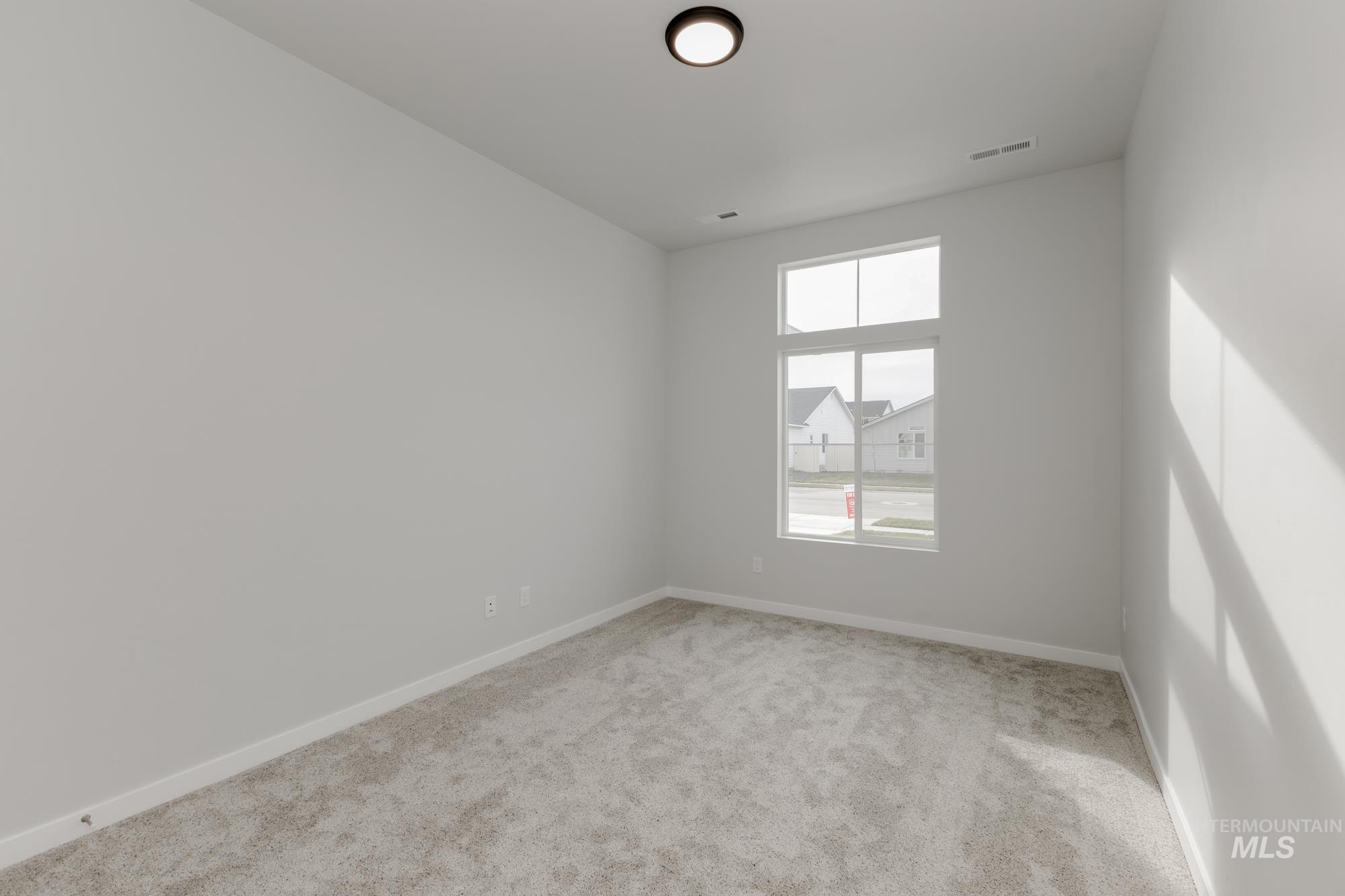 13638 Redway Court Caldwell, ID 83607 - Photo 12 of 21 Carpeted spare room featuring baseboards