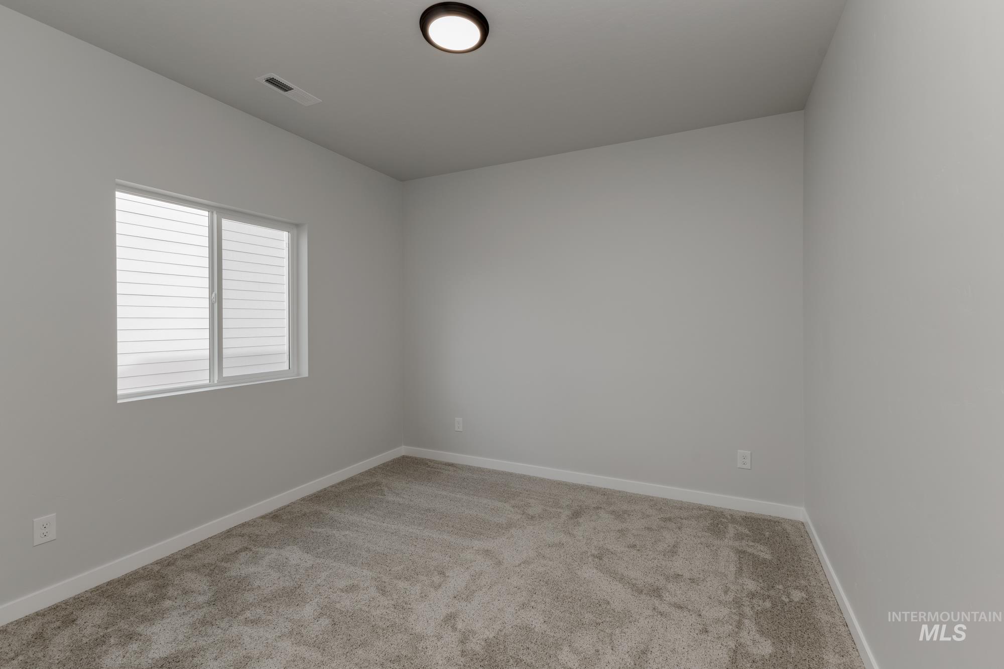 13638 Redway Court Caldwell, ID 83607 - Photo 13 of 21 Unfurnished room featuring light carpet and baseboards