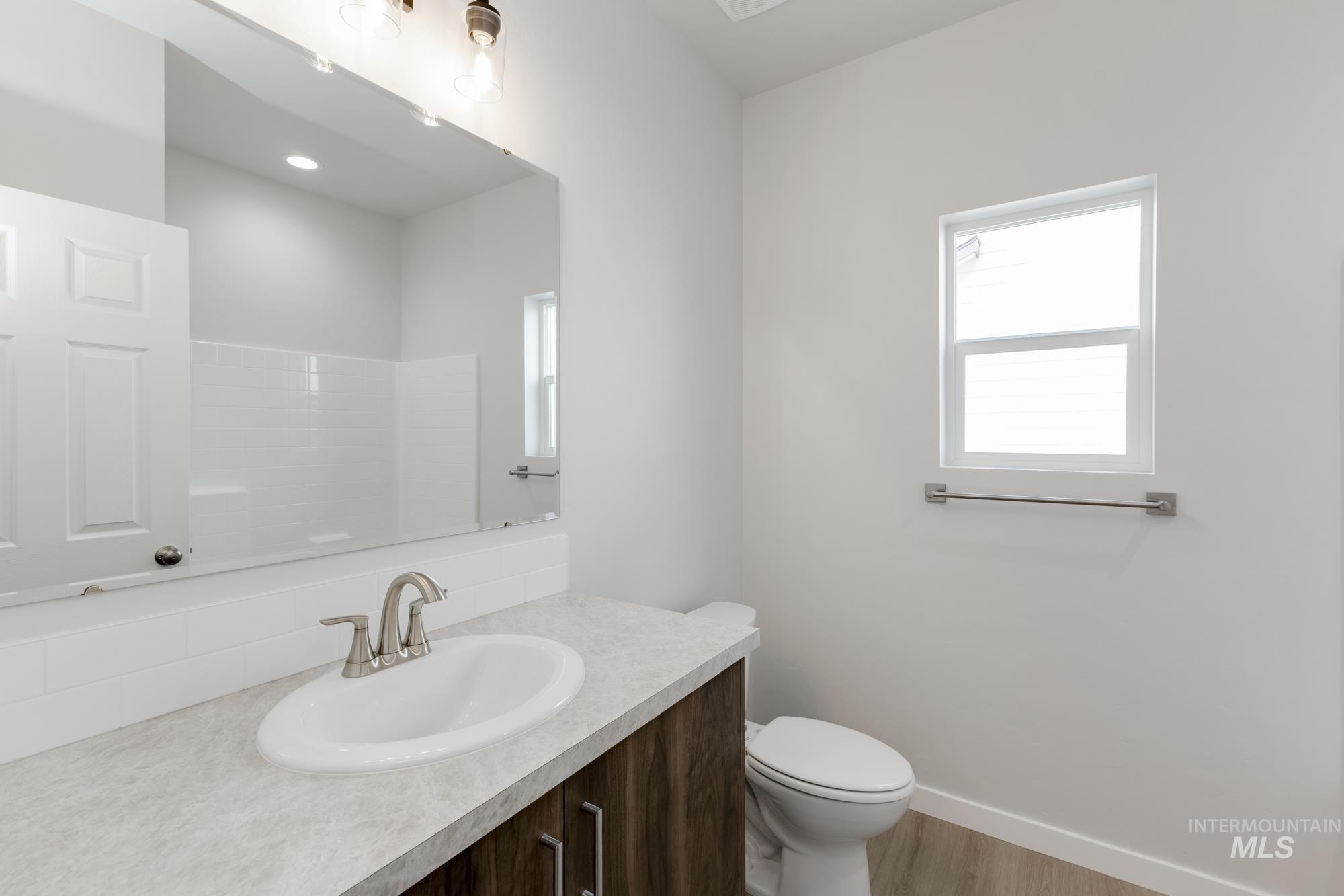 13638 Redway Court Caldwell, ID 83607 - Photo 15 of 21 Bathroom with vanity and wood finished floors