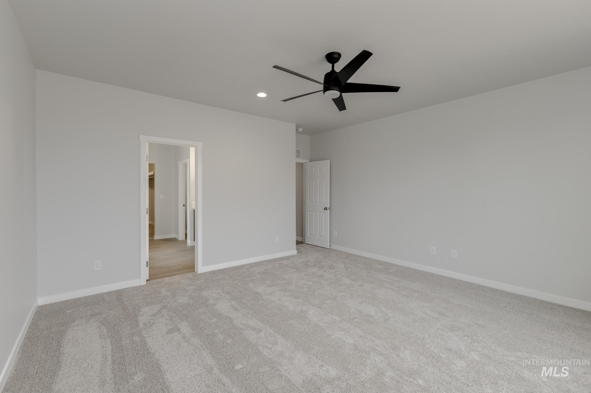 13638 Redway Court Caldwell, ID 83607 - Photo 18 of 21 Unfurnished bedroom featuring ceiling fan, light carpet, and recessed lighting
