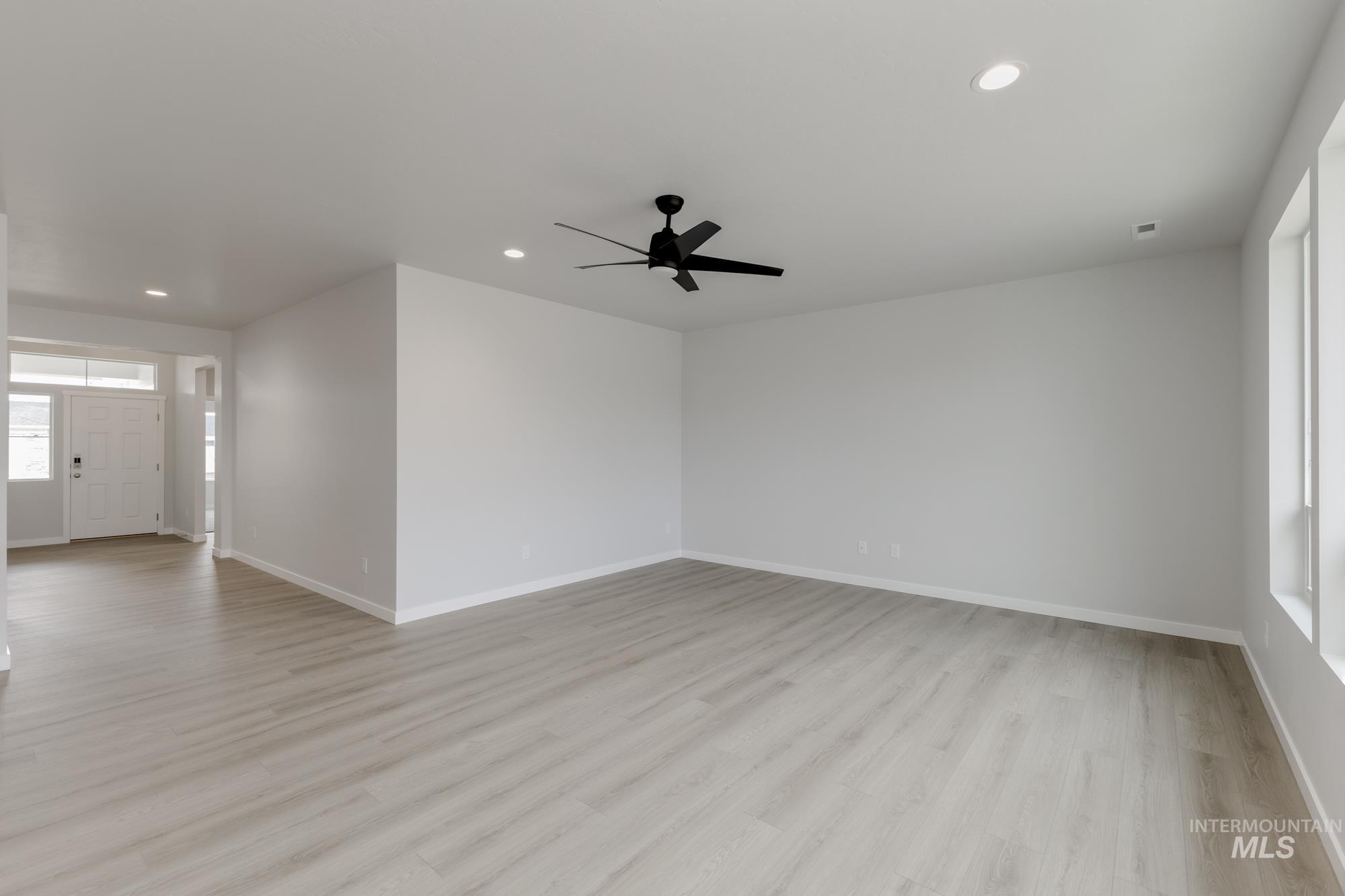13638 Redway Court Caldwell, ID 83607 - Photo 10 of 21 Empty room featuring recessed lighting, light wood-type flooring, and a ceiling fan