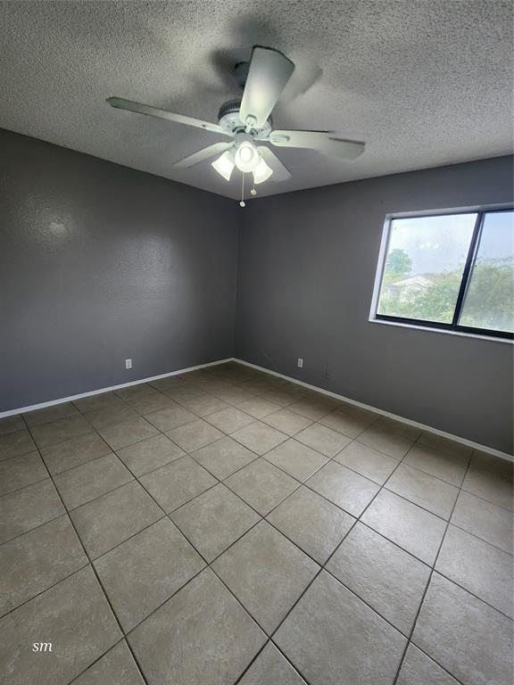 2866 South University Drive, Unit 5308 Davie, FL 33328 - Photo 13 of 26 a view of an empty room with a window