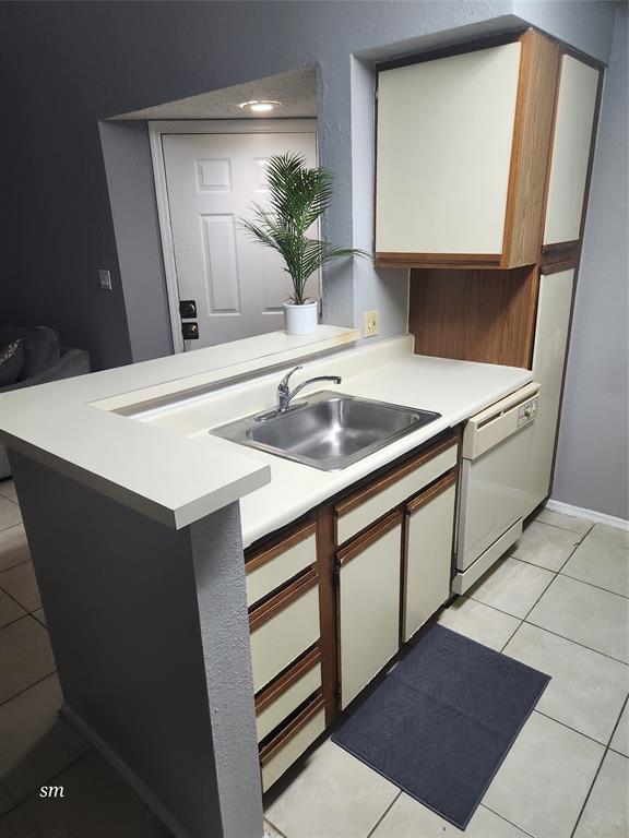 2866 South University Drive, Unit 5308 Davie, FL 33328 - Photo 23 of 26 a kitchen with a sink and cabinets