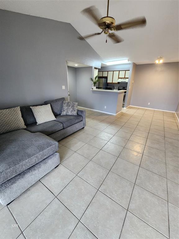 2866 South University Drive, Unit 5308 Davie, FL 33328 - Photo 8 of 26 a living room with furniture and a chandelier