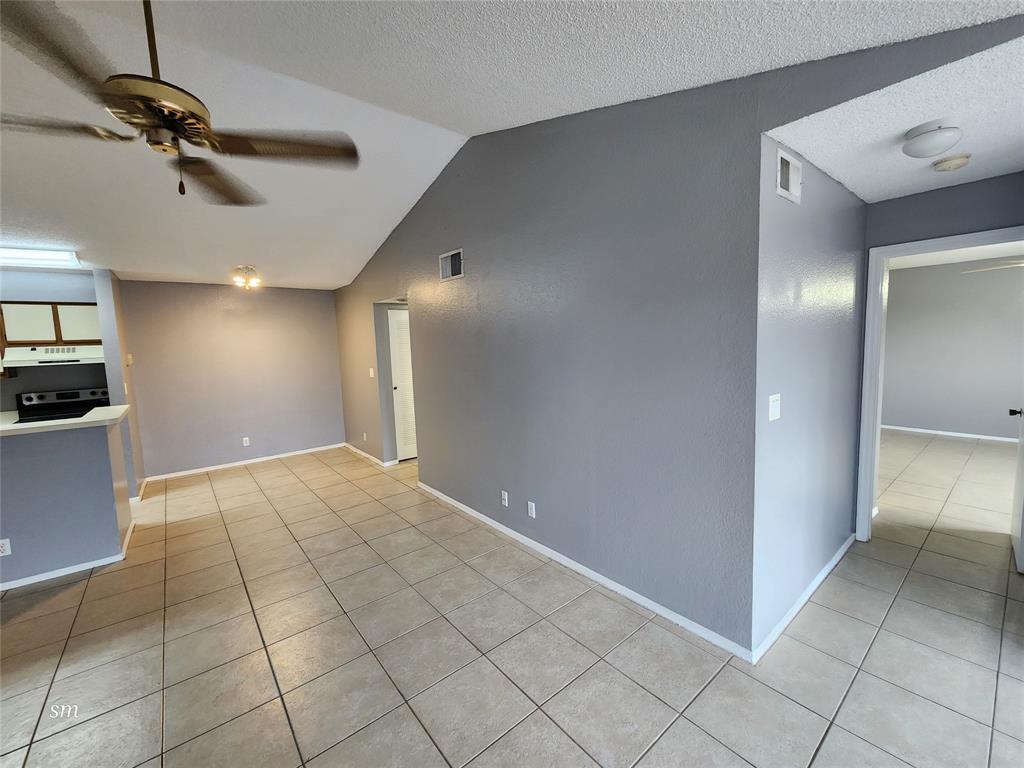 2866 South University Drive, Unit 5308 Davie, FL 33328 - Photo 10 of 26 a view of an empty room and a kitchen