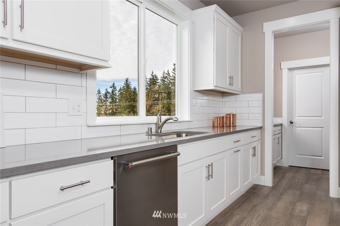 6505 Southeast 2nd Place Renton, WA 98059 - Photo 13 of 25 a kitchen with a sink cabinets and window