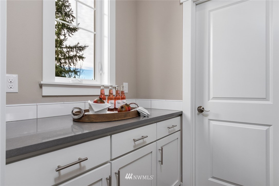 6505 Southeast 2nd Place Renton, WA 98059 - Photo 14 of 25 a bathroom with a sink and a mirror