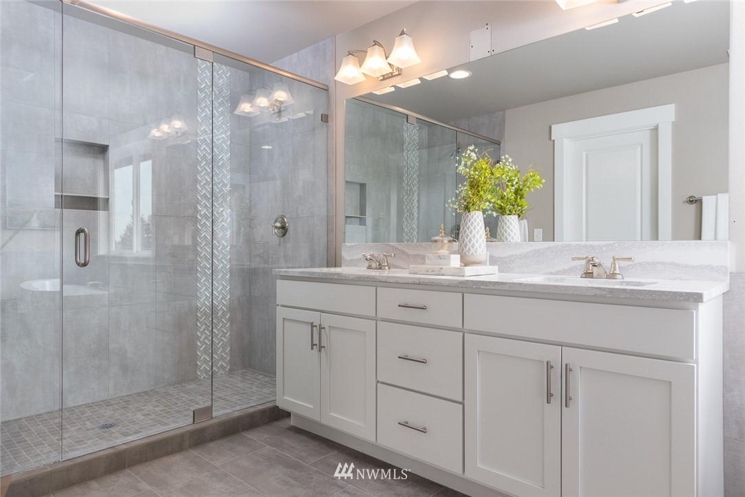 6505 Southeast 2nd Place Renton, WA 98059 - Photo 19 of 25 a bathroom with a shower sink and mirror