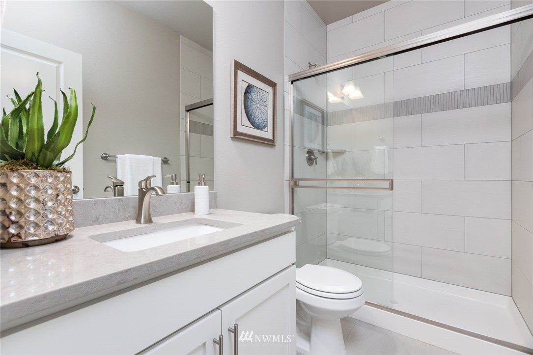6505 Southeast 2nd Place Renton, WA 98059 - Photo 21 of 25 a bathroom with a sink a toilet and shower