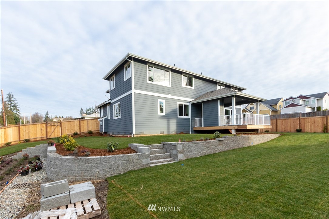 6505 Southeast 2nd Place Renton, WA 98059 - Photo 23 of 25 a view of a house with a yard and sitting area
