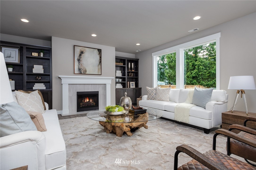6505 Southeast 2nd Place Renton, WA 98059 - Photo 9 of 25 a living room with furniture and a fireplace