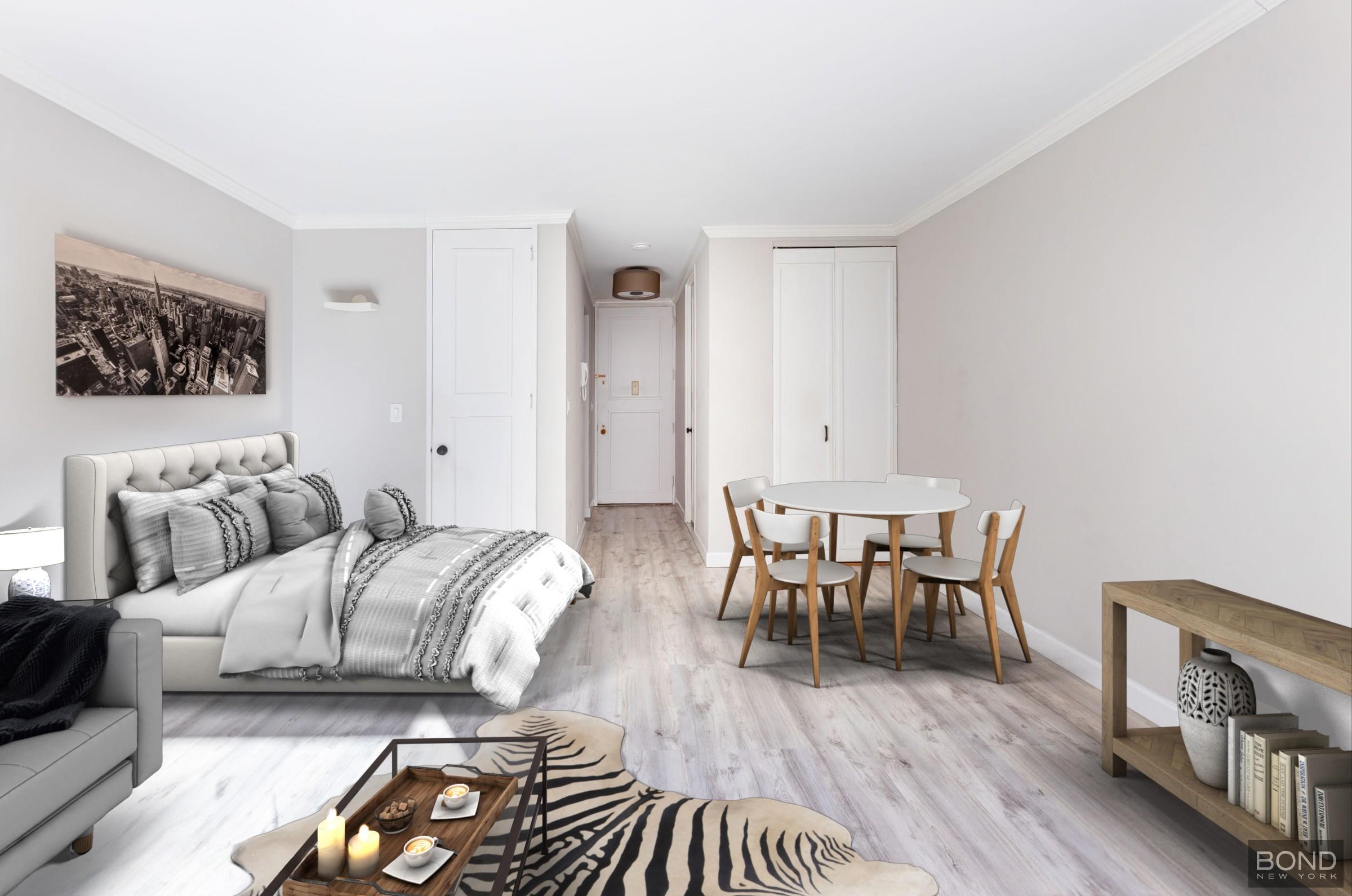 393 West 49th Street, Unit 3OO Manhattan, NY 10019 - Photo 4 of 16 a living room with furniture and a wooden floor