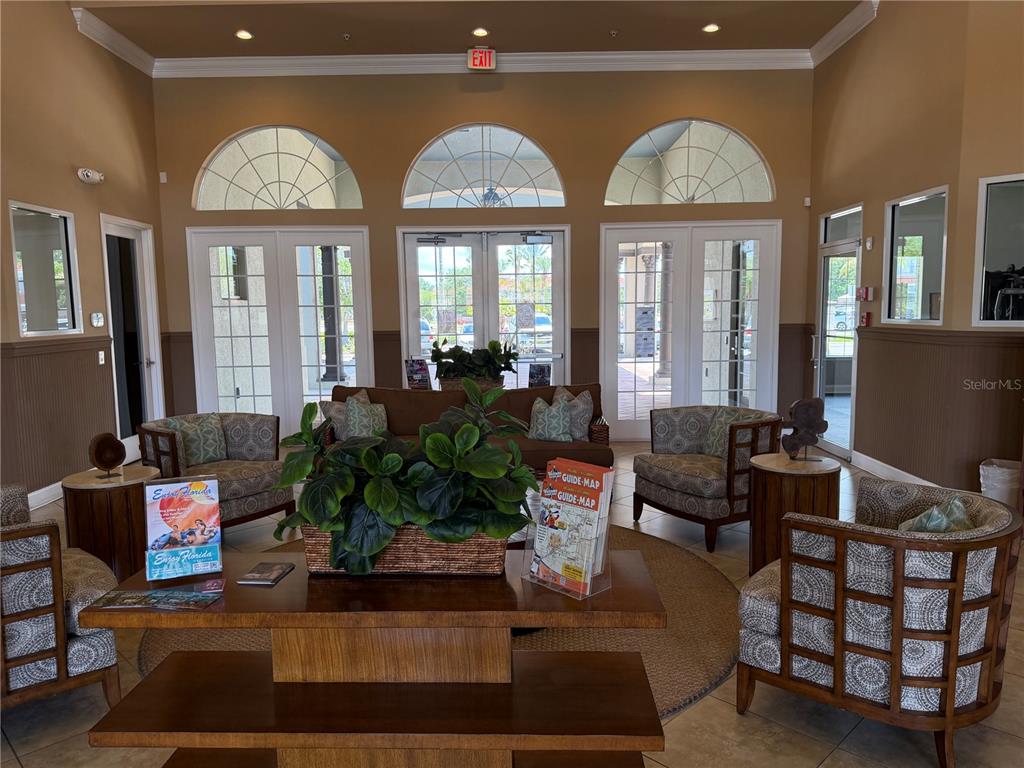 4573 Ada Lane Kissimmee, FL 34746 - Photo 32 of 37 a living room with furniture fireplace and large windows