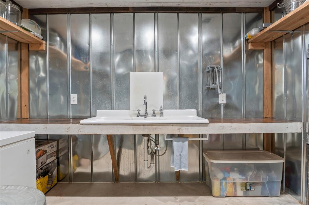 7949 North Fm 373 Road Muenster, TX 76252 - Photo 18 of 38 a bathroom with a granite countertop sink a toilet and shower
