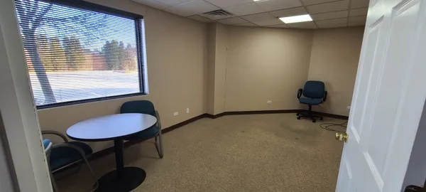 a workspace with furniture and a window