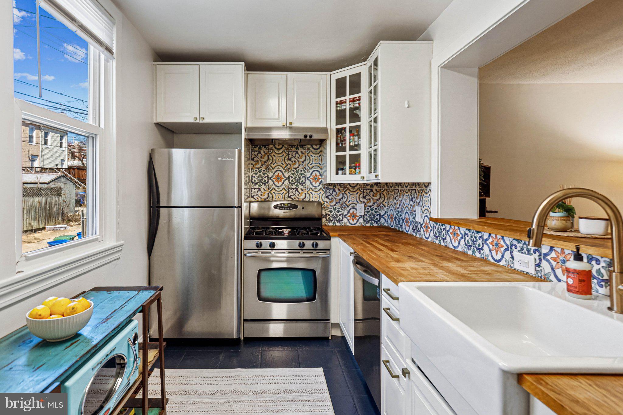 3124 Chestnut Avenue Baltimore, MD 21211 - Photo 12 of 25 Charming kitchen with vibrant tiles.
