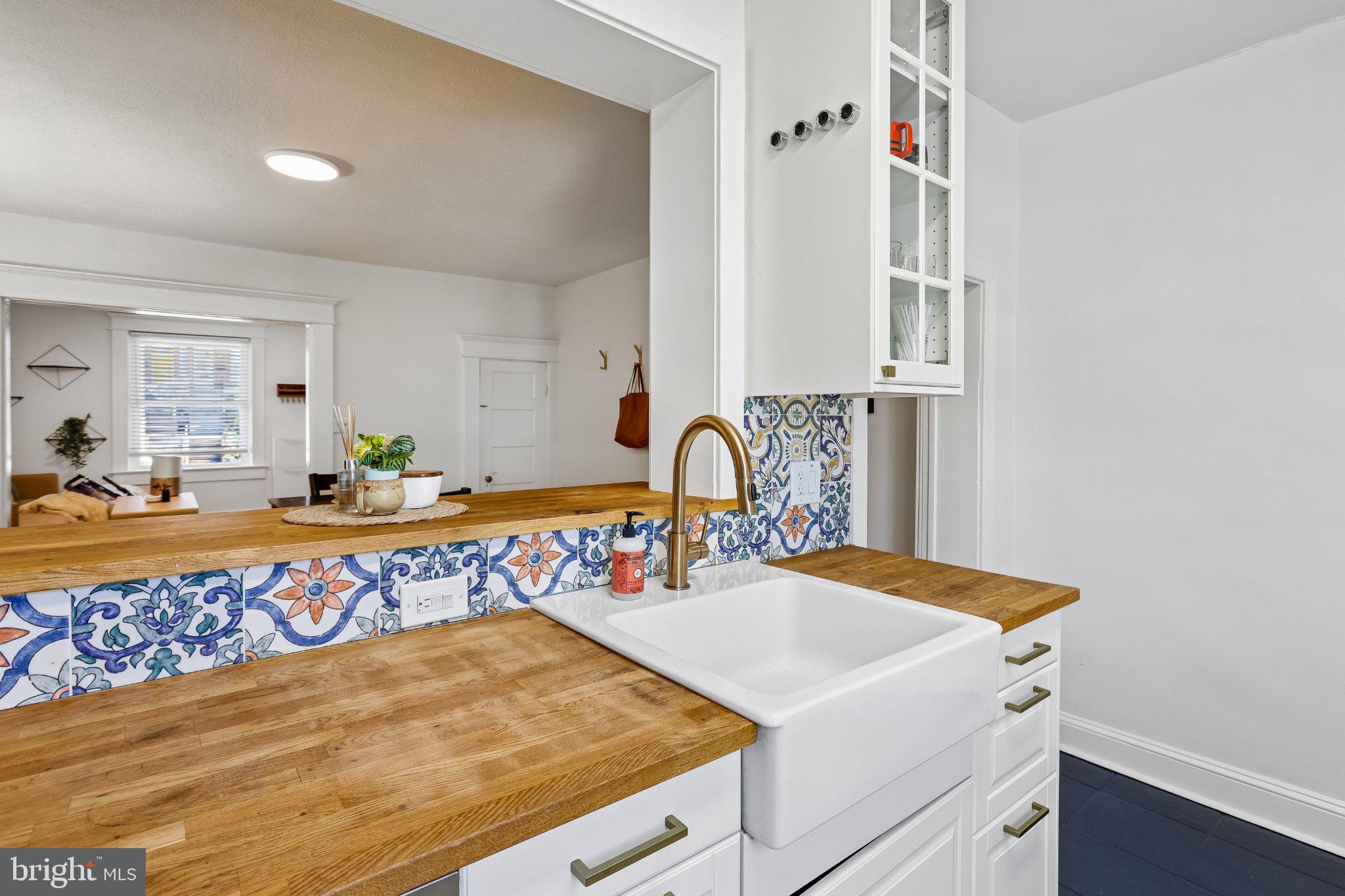 3124 Chestnut Avenue Baltimore, MD 21211 - Photo 13 of 25 Charming kitchen with vibrant tiles.