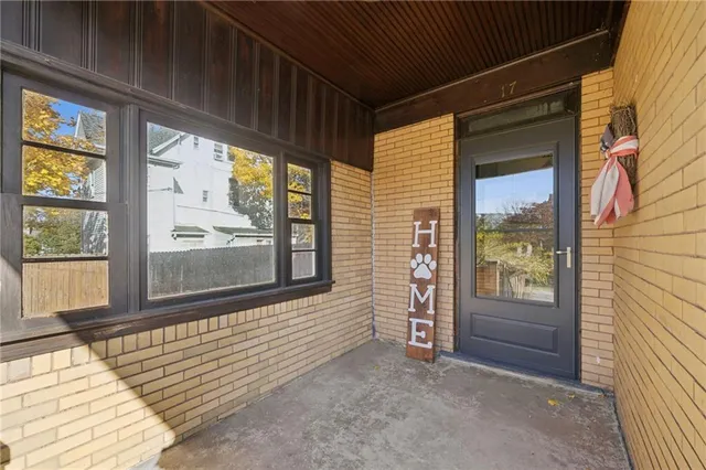 a view of front door of house with window